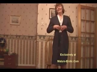 Enticing Granny In Stockings And Girdle shows Off Hairy
